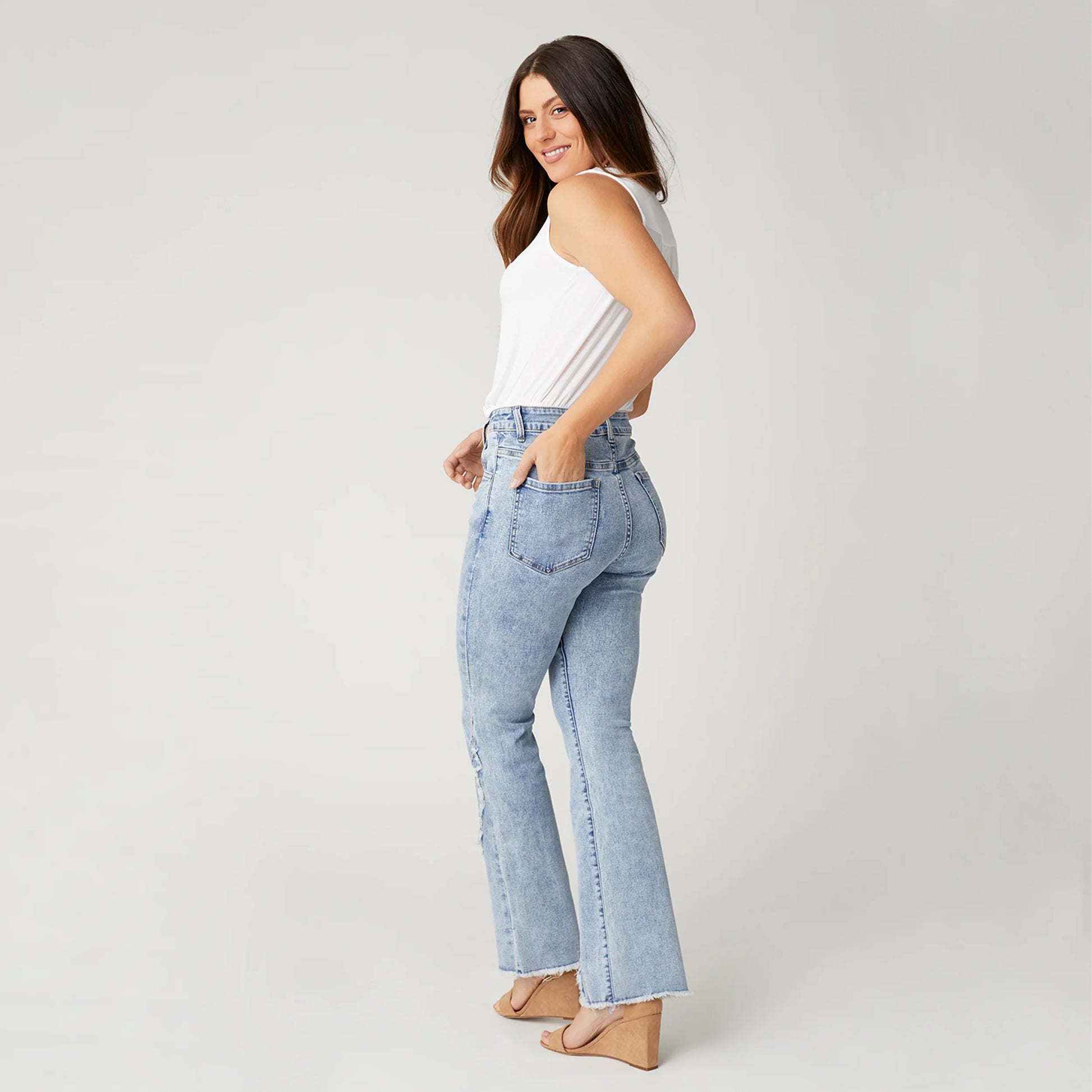 EVERSTRETCH FLARE JEANS WITH CROSSOVER FRINGE